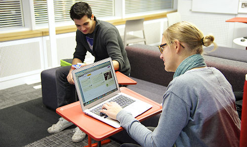 Person sat on laptop